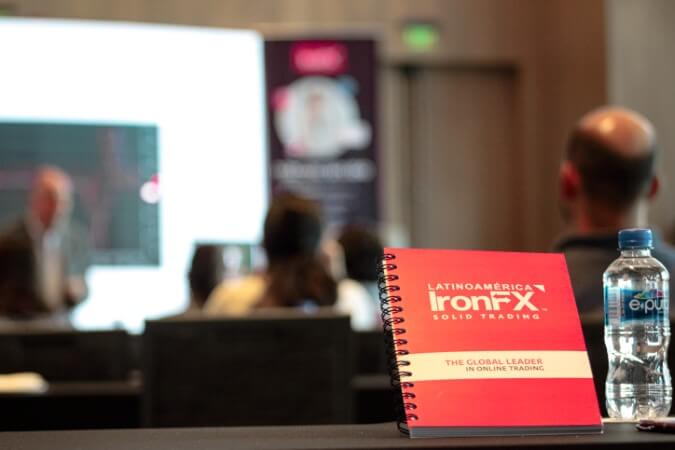 Educational seminar in Mexico with IronX team and Iron Fx logo visible.