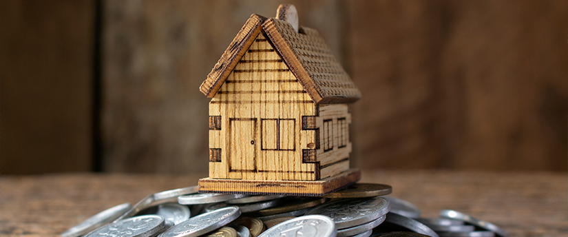 Yen symbols creatively intertwining to construct a symbolic house, representing financial stability and the Japan's housing market.
