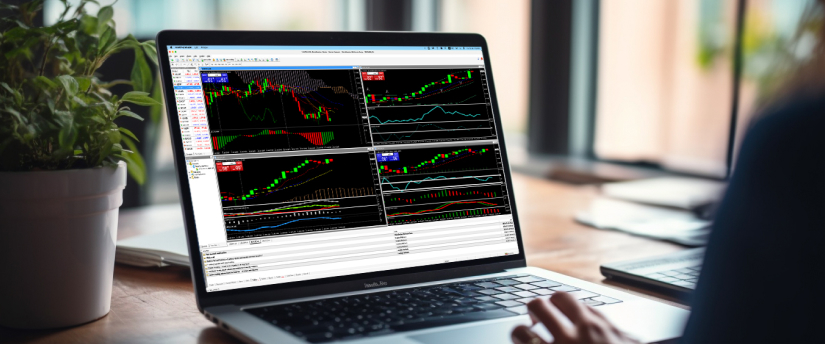 User viewing multiple MT4 indicators on a laptop, analysing charts, trend tools and technical signals on the MetaTrader 4 platform.
