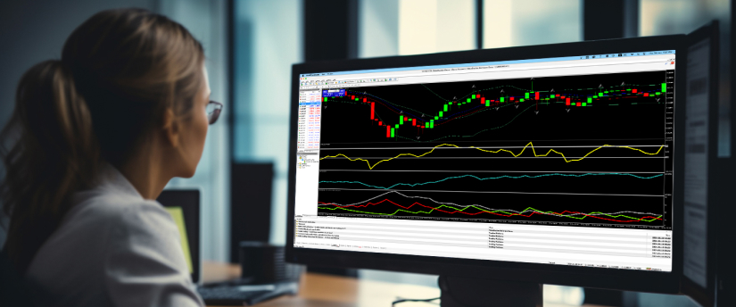 A woman analyzing a trading chart on a laptop with trader indicators.