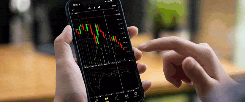 Device with forex and stock trading platforms displayed, showing charts, graphs, and market trends for informed decision-making.