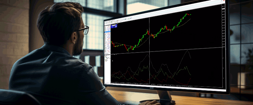 A focused man at a desk reviews trading stock charts on his computer, showcasing expertise in MT4 market analysis.