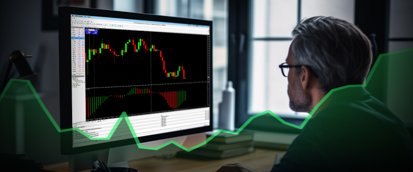A man observes a computer screen featuring an upward trend line, symbolizing an increase in performance on day trading.