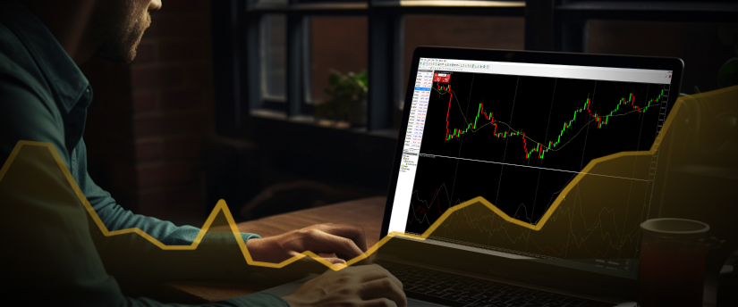 Uma pessoa usando um laptop para negociar forex, com gráficos e tabelas exibidos na tela para análise de mercado